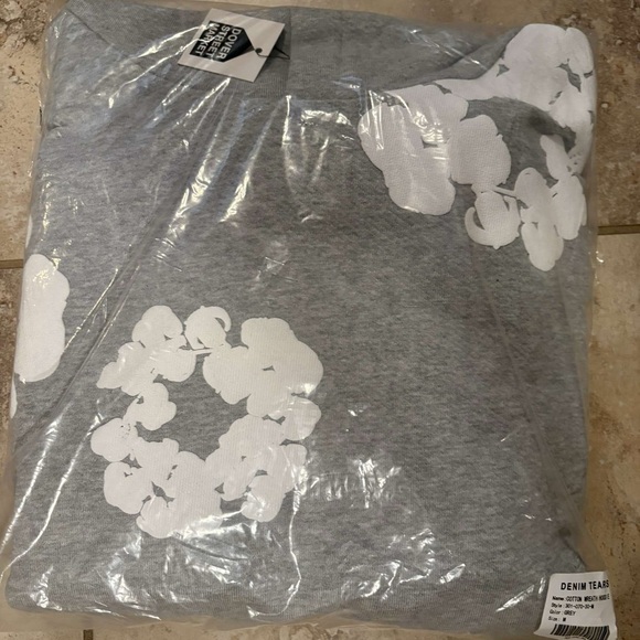 Denim Tears Gray Sweater with White Floral Design